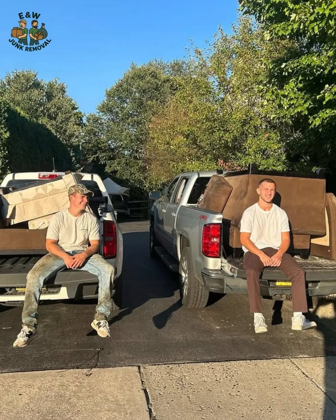 Ed and Whit sitting on their pickup tailgates with a load of couches ready to haul